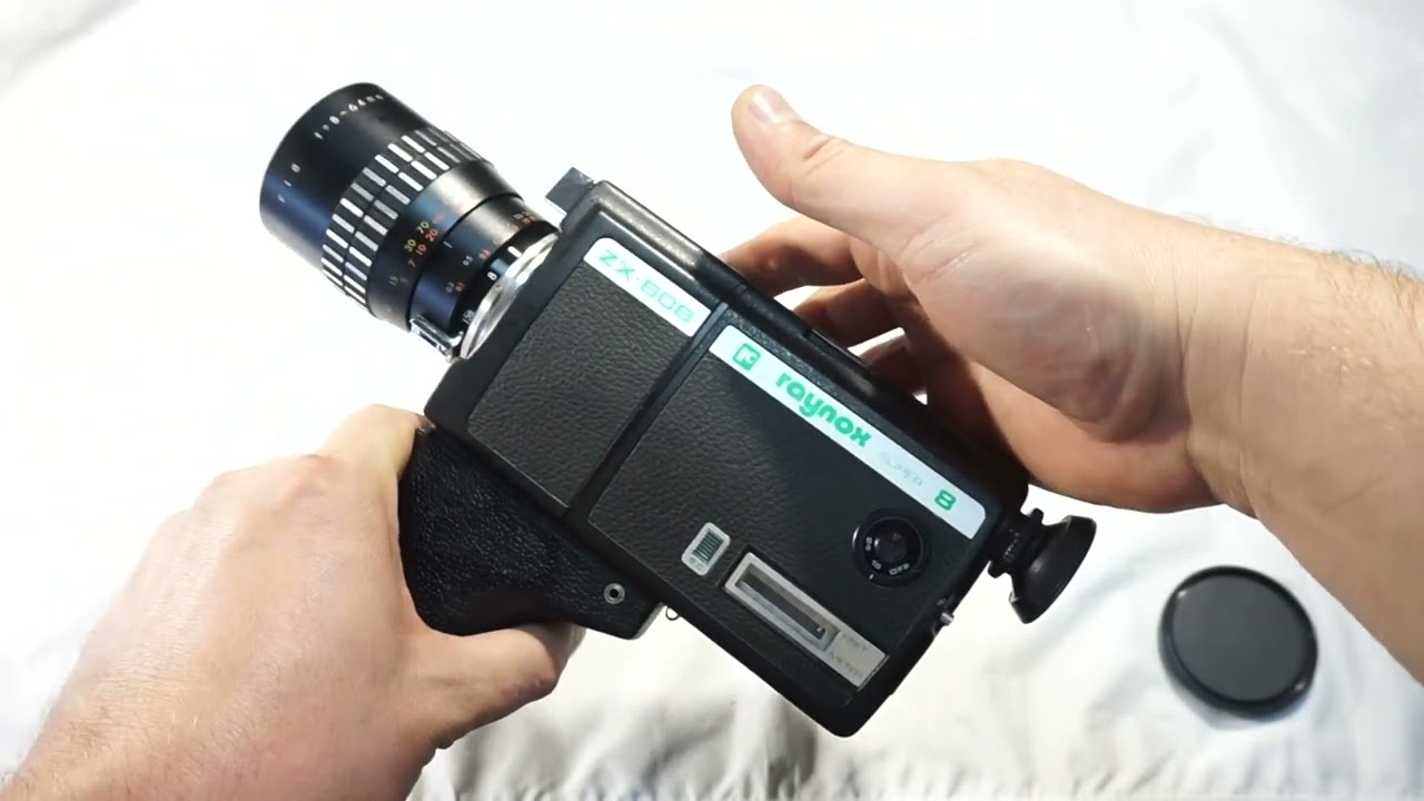 Raynox ZX-808 loading Super 8 film and batteries on Super 8 camera