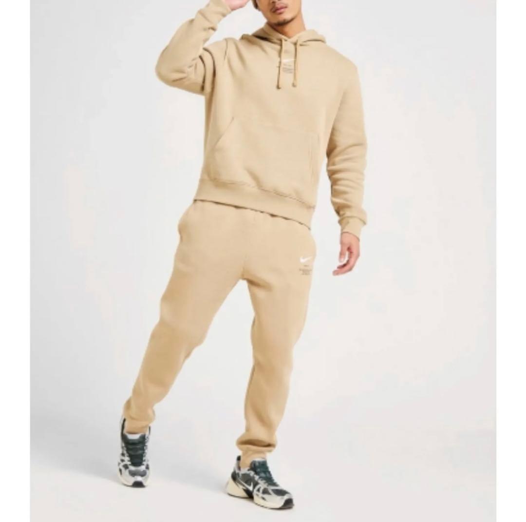 NIKE スウッシュロゴ ベージュ セットアップ - メルカリ