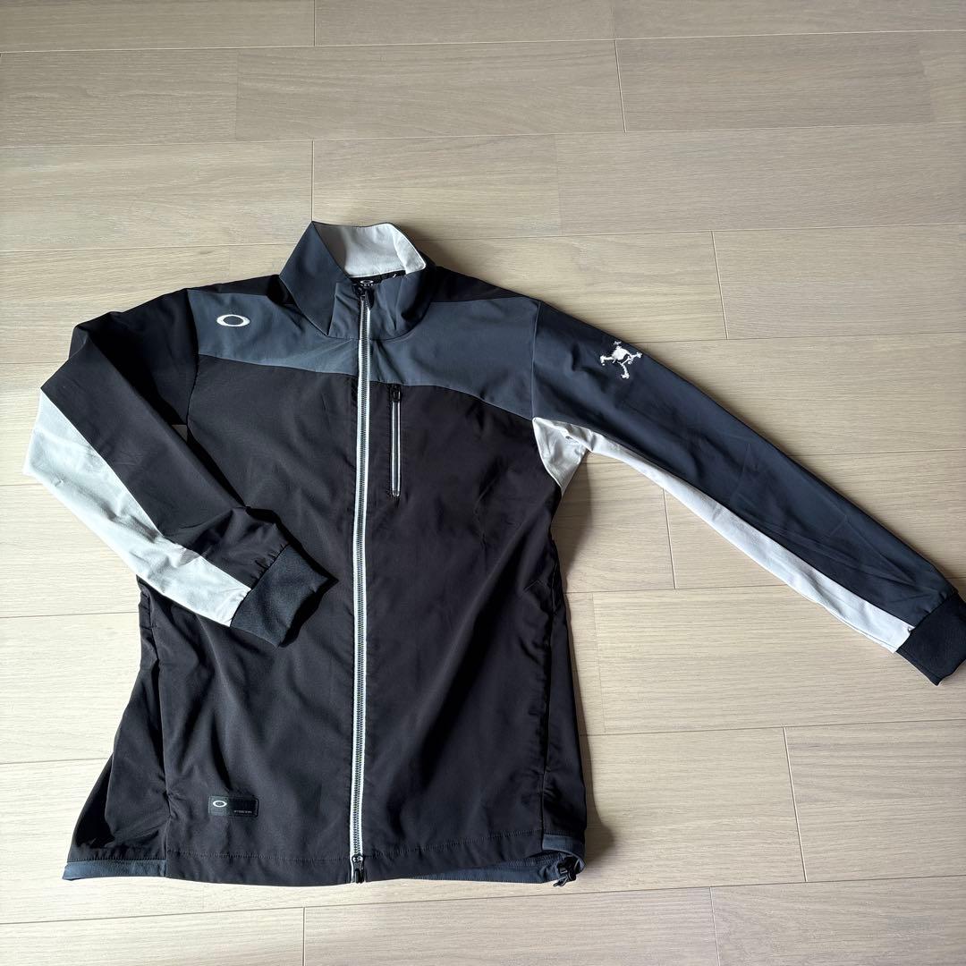 Oakley ジャケット Ｌサイズ　ブラック/グレー OAKLEY（オークリー） コート ジャケット ENHANCE ACTIVE WIND JACKET